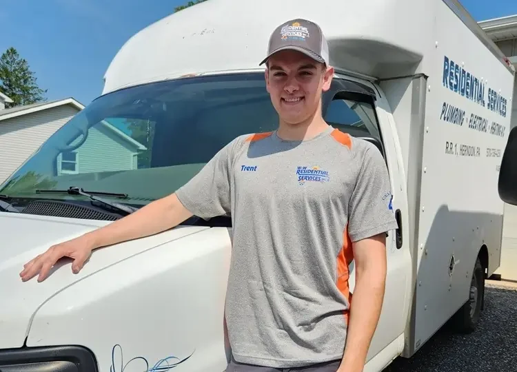 HVAC technician by work van